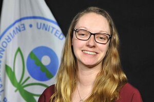 Smiling young woman in glasses