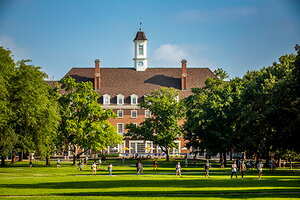 View across the green quad and trees to the Union 