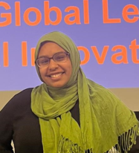 Smiling young woman in glasses