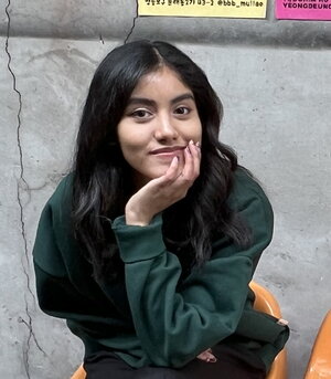 Young woman in dark green sweater