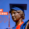 Alma Mater statue wearing a graduation cap and robe with the text "Illini success" 