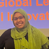 Smiling young woman in glasses