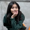 Young woman in dark green sweater